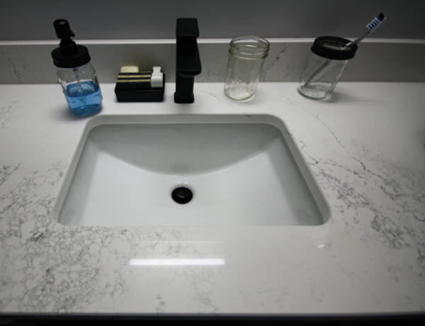 Undermount sink and matte black faucet